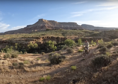 E-Bike Duo Admiring Jem Trail's Panoramic Beauty near Zion