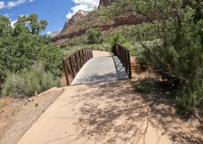 Family E-Bike Adventure on Scenic Pa'Rus Trail: Rustic Fence and Red Rock Views